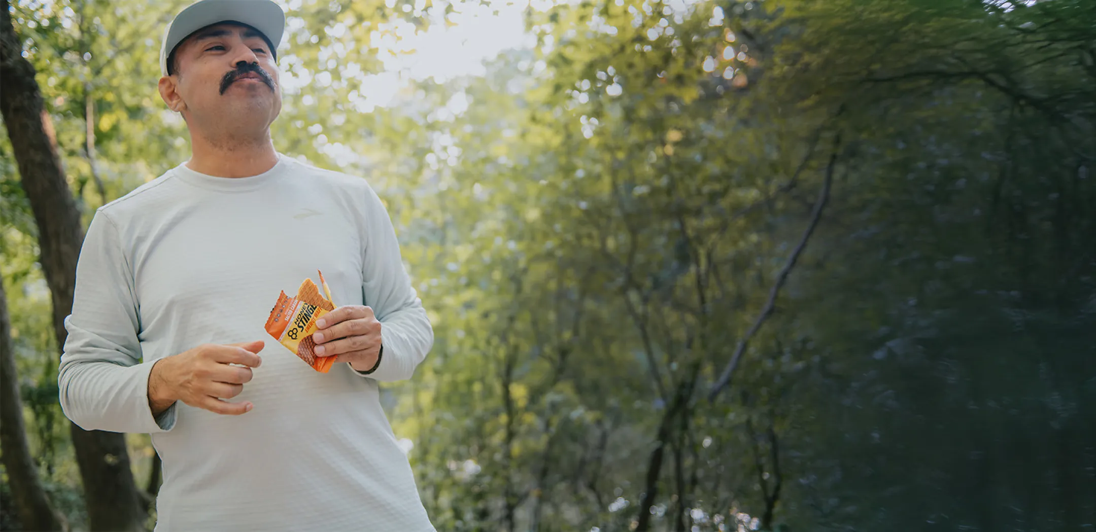 Trail runner eating Honey Stinger Waffle