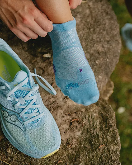Runner putting on socks