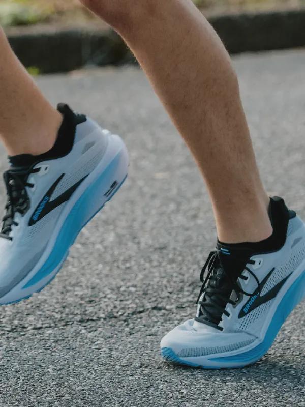 close up angle of a person wearing the blue ghost 18 shoes