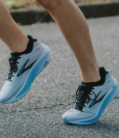 close up angle of a person wearing the blue ghost 18 shoes